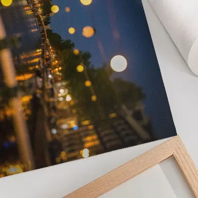 Poster a charming city at night with lights reflected in the water