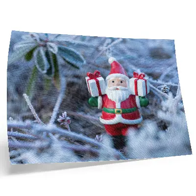 Santa Claus with gifts decorative canvas print in a winter setting