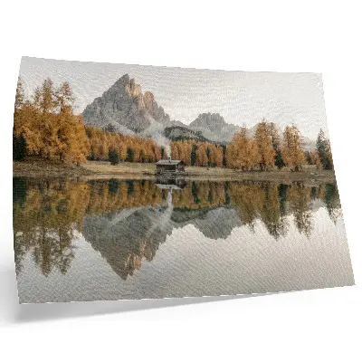 Decorative canvas print mountains with a cottage reflecting on a calm lake amidst golden trees