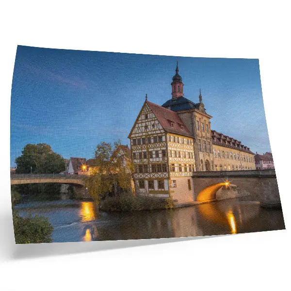 Decorative canvas print featuring a historic building by a water bridge under a blue sky