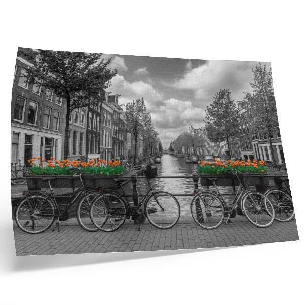 Decorative canvas print A charming view of the canal, bicycles, tulips, black and orange