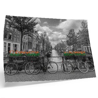 Decorative canvas print A charming view of the canal, bicycles, tulips, black and orange