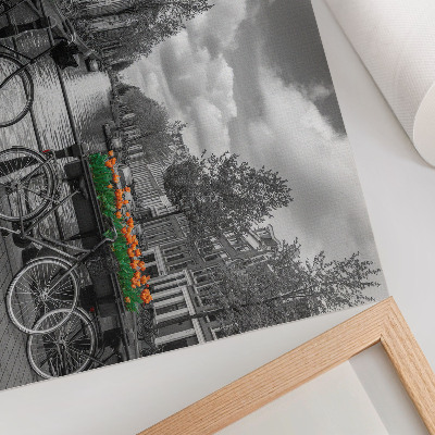 Decorative canvas print A charming view of the canal, bicycles, tulips, black and orange