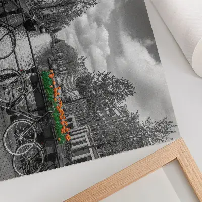 Decorative canvas print charming canal view with bicycles and tulips in black and orange