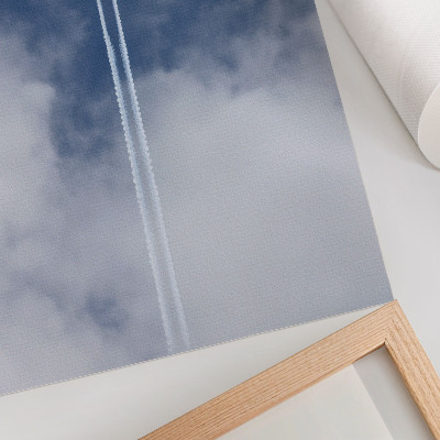 Decorative canvas print Airplane in the blue sky with white streaks