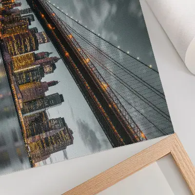 Poster panoramic evening city view with bridge, lights, and water