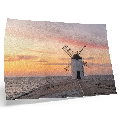 Poster windmill in sunset light with a pastel sea sky
