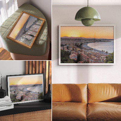 Photo canvas View of the city at sunset over the sea