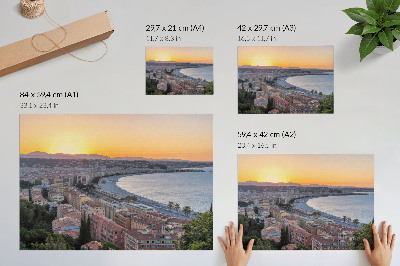 Photo canvas View of the city at sunset over the sea