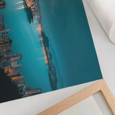 Decorative canvas print night city view over the water with luminous skyscrapers