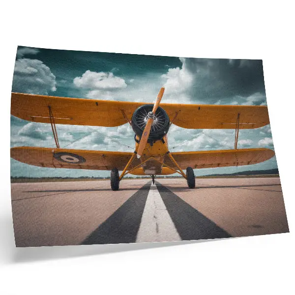 Decorative canvas print airplane on a runway under a dynamic sky