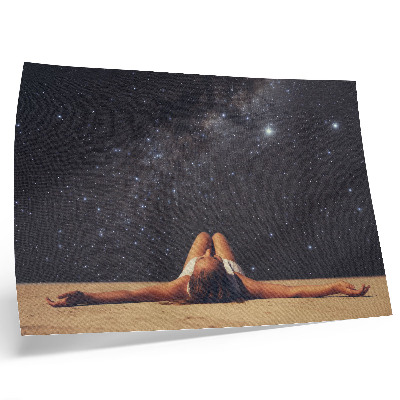 Decorative canvas print A figure under a starry sky looks surreal