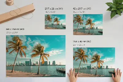 Photo canvas featuring palm trees by a calm lake under a turquoise sky with city skyscrapers