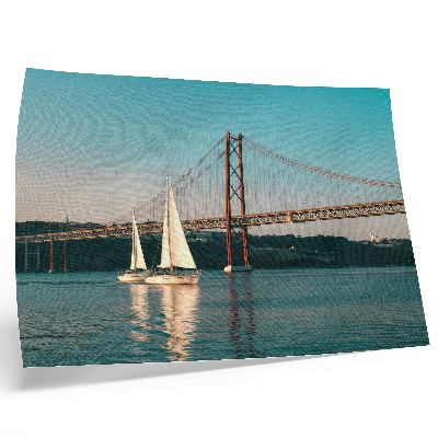 Photo canvas A bridge and sailboats over the water in pastel tones