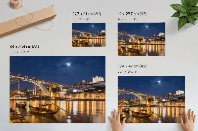 Poster bridge at night with city lights, water, and boats