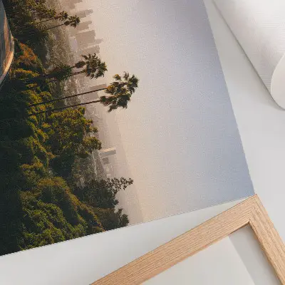 Photo canvas palm trees and city skyline in the sunshine