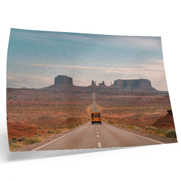 Decorative canvas print A straight road, monumental mountains, warm colors