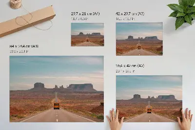 Decorative canvas print a straight road with monumental mountains in warm colors