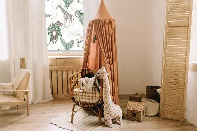 Fabric roller blind with a giraffes, elephants, and leaves pattern