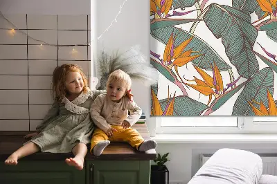 Fabric roller blind with a green leaves pattern