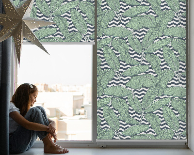 Modern roller blind with a palm leaves print on a black and white background