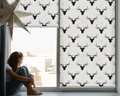 Fabric roller blind with black deer heads pattern