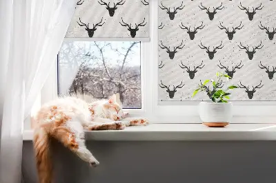 Fabric roller blind with black deer heads pattern