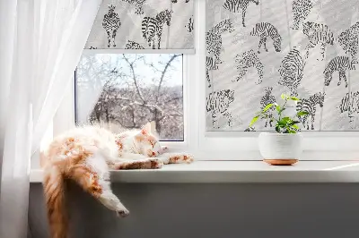 Fabric roller blind with a gray animal pattern