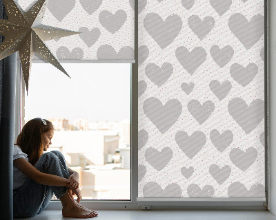 Fabric roller blind with a gray hearts pattern