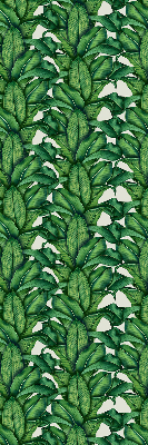 Fabric roller blind with a green leaves pattern