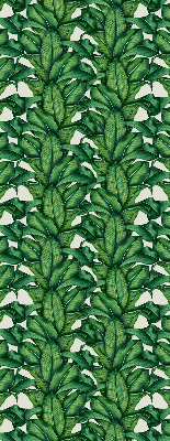 Fabric roller blind with a green leaves pattern