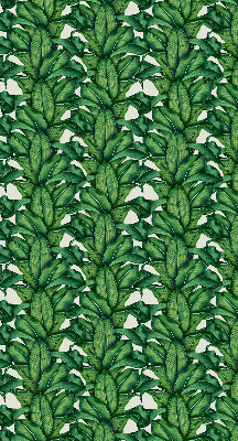 Fabric roller blind with a green leaves pattern