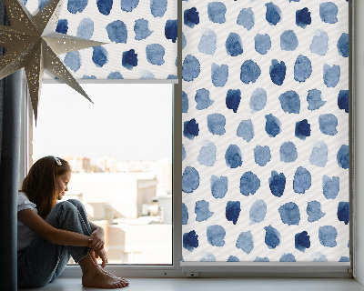Fabric roller blind with a blue painted spots pattern