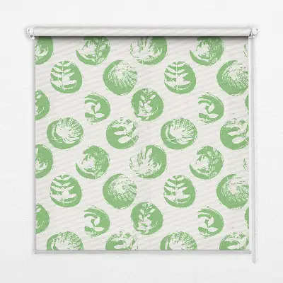 Fabric roller blind with plants reflected on green circles pattern