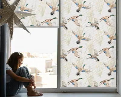 Fabric roller blind with a flying ducks pattern
