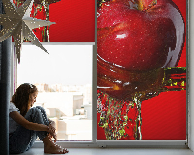 Fabric roller blind An apple doused with water
