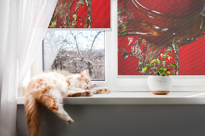 Fabric roller blind An apple doused with water
