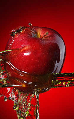 Fabric roller blind An apple doused with water