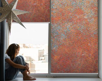 Fabric roller blind in orange sheet metal