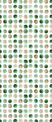Blackout roller blind with a green circles pattern