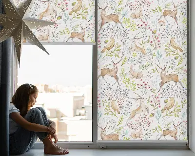 Blackout roller blind with roe deer, birds, and rabbits print