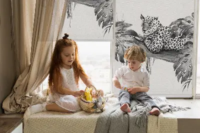 Blackout roller blind for window with a pattern of cheetahs on a branch