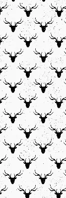 Blackout roller blind with black deer head pattern