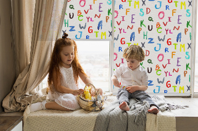 Fabric roller blind for window with colorful letters design