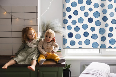 Blackout roller blind for window with blue dots pattern