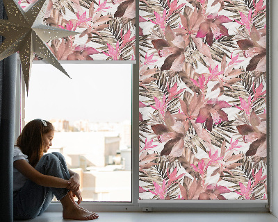Blackout roller blind for window with a pink flower pattern
