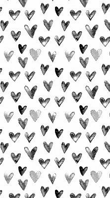 Blackout roller blind for window with black hearts pattern