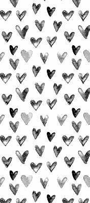 Blackout roller blind for window with black hearts pattern