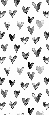 Blackout roller blind for window with black hearts pattern
