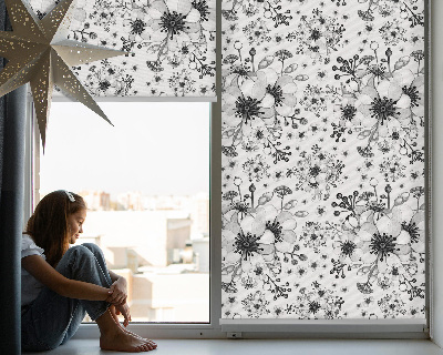Blackout roller blind with a drawn flower pattern